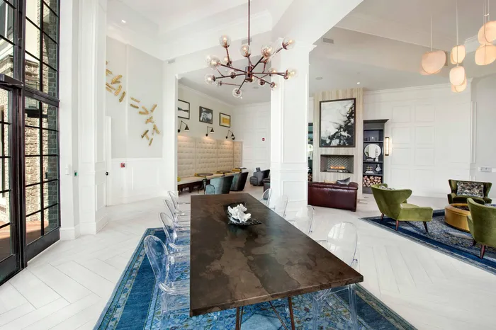 furnished clubroom with long dining table