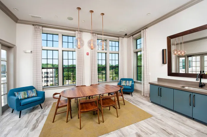 furnished clubroom with high ceilings
