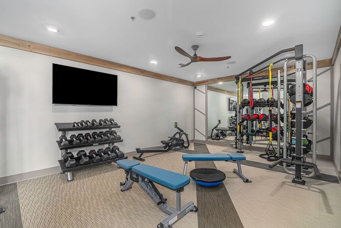 furnished fitness area with equipment
