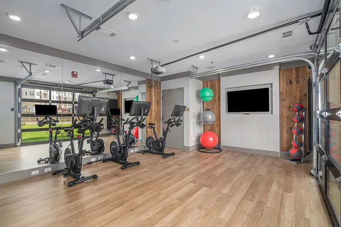 furnished fitness area with equipment