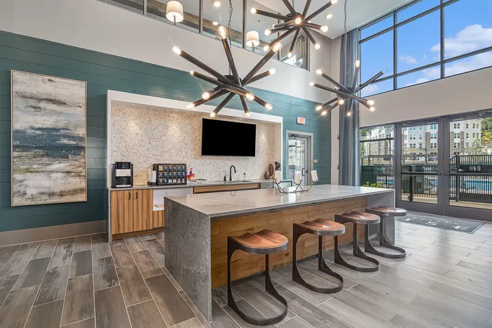 furnished kitchen area in clubroom with island