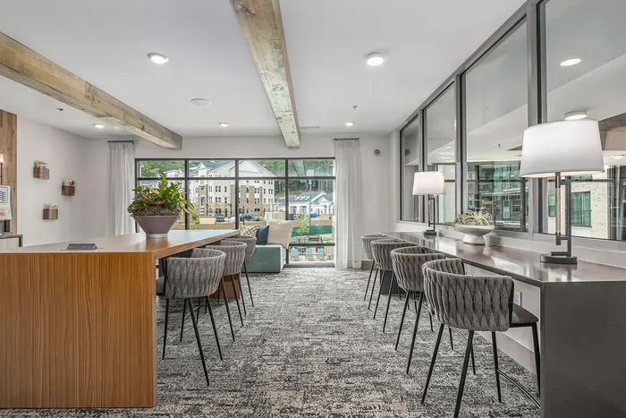 furnished clubroom area with tables and chairs