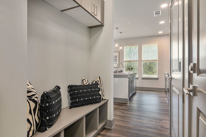 furnished mudroom area of front of apartment
