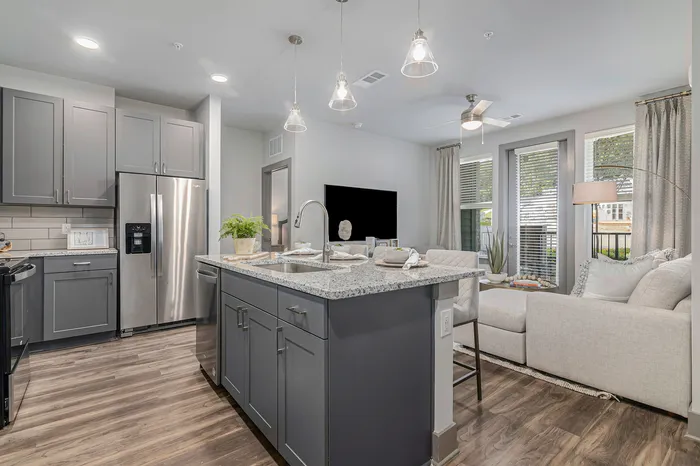 furnished kitchen with island in apartment home