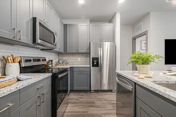 furnished kitchen with island in apartment home
