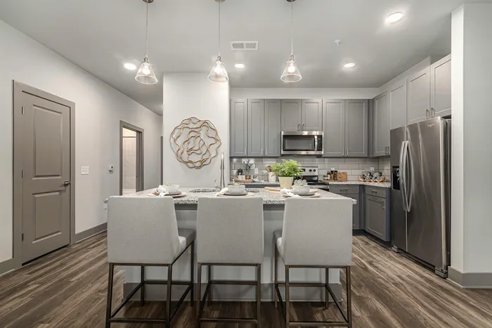 furnished kitchen with island in apartment home