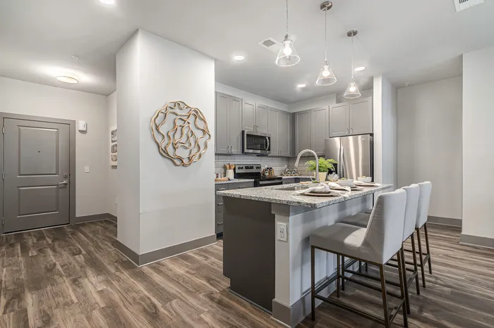furnished kitchen with island in apartment home
