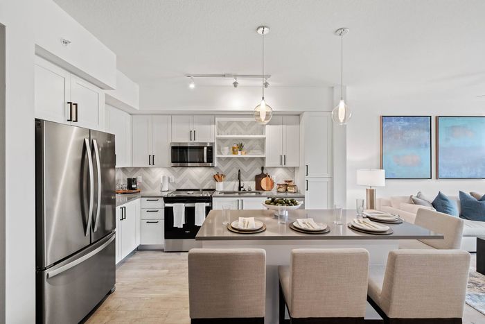 Active Adult, 55+ Living In South FL - Kitchens Has Designer Tiled Back Splash, Quartz Countertops, Dishwasher, Microwave, Refrigerator, Kohler Plumbing Fixtures, And European Cabinetry.