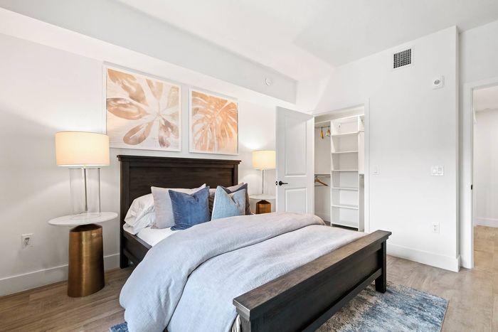 1 BR Apartments In Pembroke Pines, FL - Spacious Bedroom Has Hard-Wood Flooring, Air Conditioning, And Walk-In Closet With Built-In Shelves