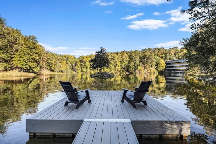 Deck with 2 chairs overlooking the water