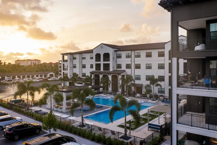 pool and apartment building at dusk