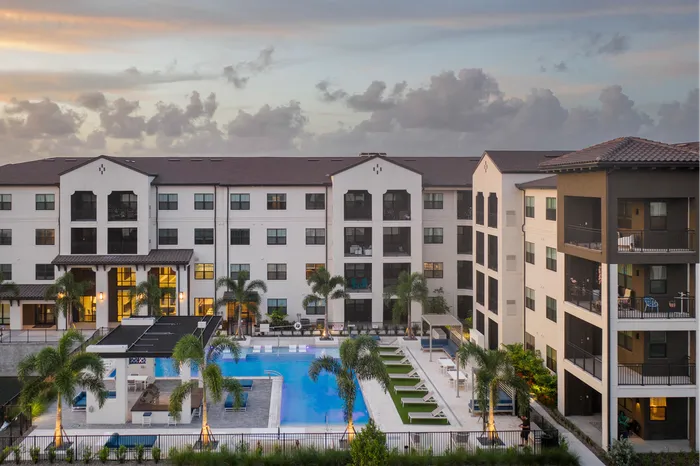 pool and apartment building at dusk