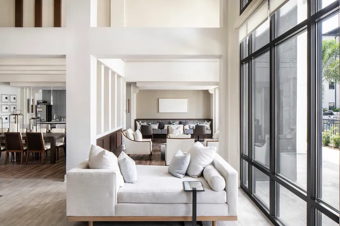 furnished clubroom with sofas and chairs
