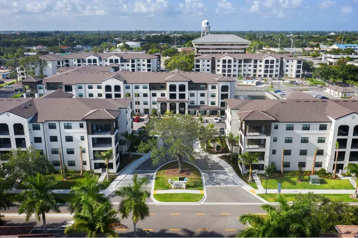 aerial shot of apartment building exterior on sunny day