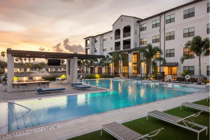 pool and apartment building at dusk