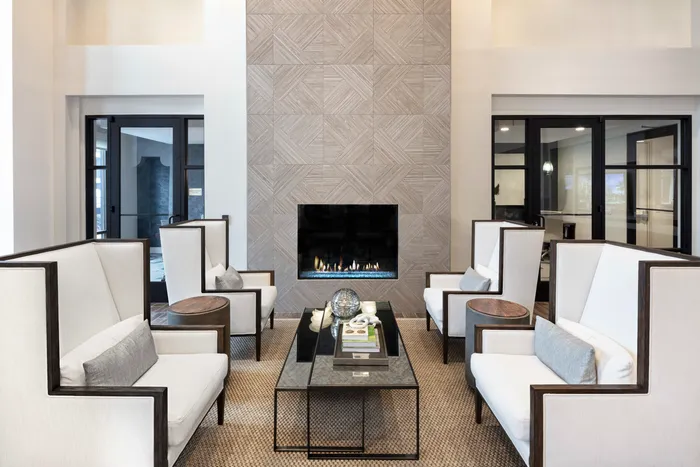 big chairs and table with fireplace