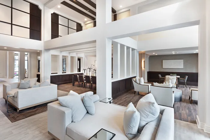 furnished clubroom with sofas and chairs
