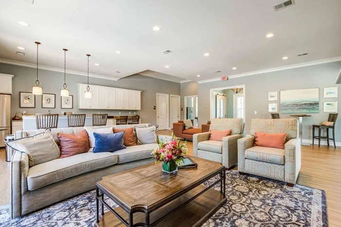 Community clubroom with furniture and kitchen area