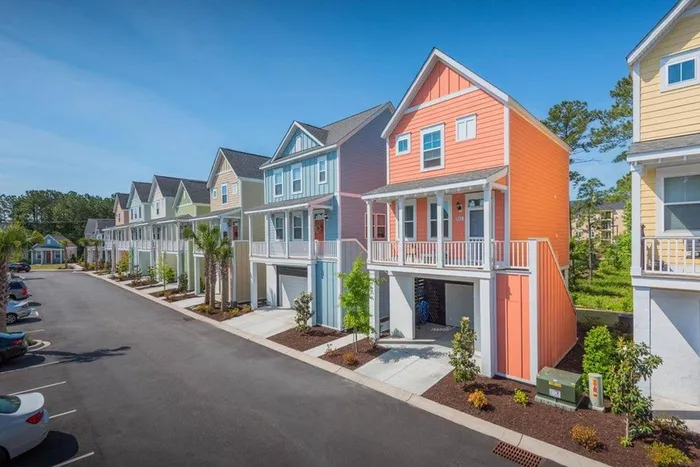 Colorful adjacent two-story cottages in day time