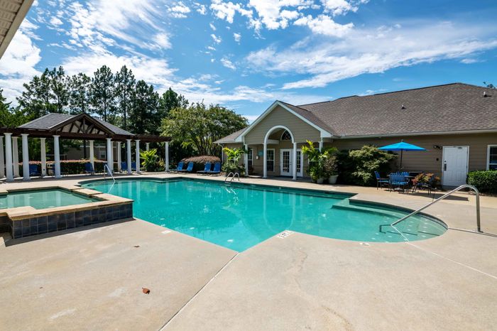 exterior pool and apartment building on sunny day
