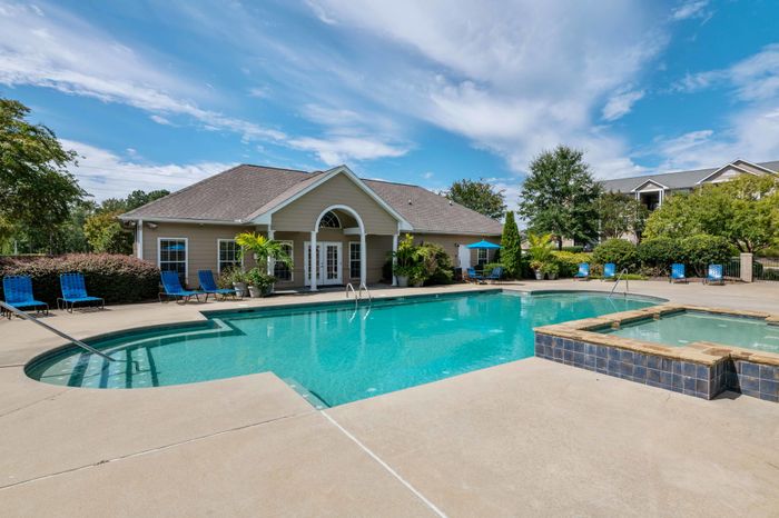 exterior pool and apartment building on sunny day