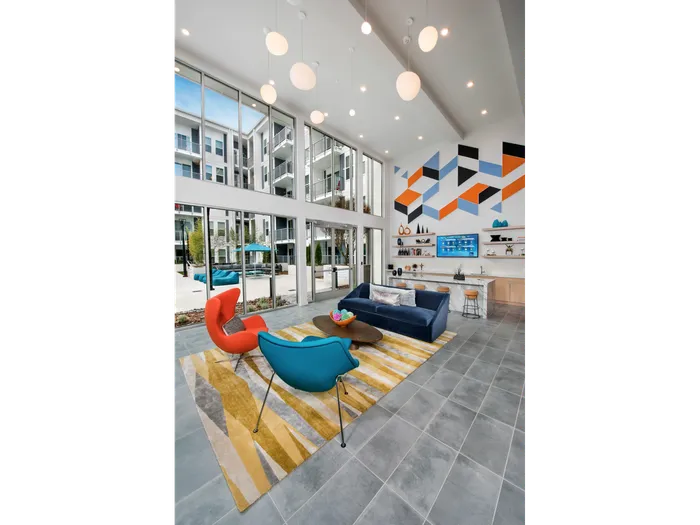 furnishec clubroom with large windows