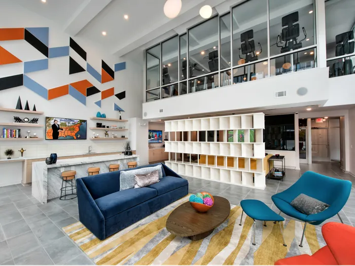 Studios In Atlanta, GA - Spectrum on Spring - Resident Lounge With An Expansive Bar, TV Gallery, Lounge Seating Areas, And Fitness Center Upstairs