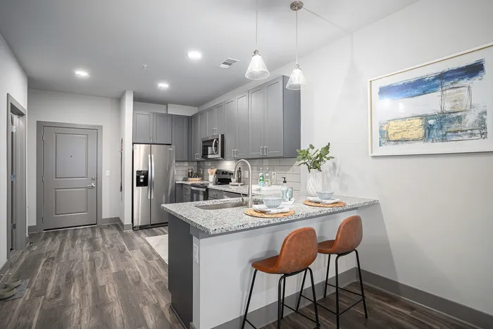 Furnished kitchen with island chairs