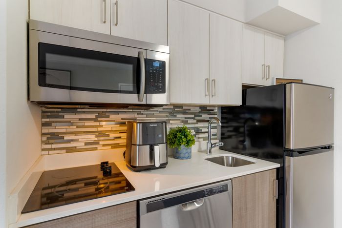 furnished kitchen area of apartment home