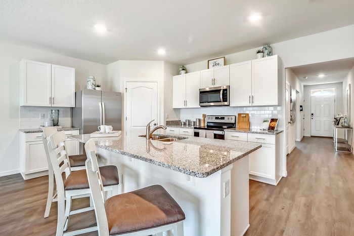 furnished kitchen with island in home