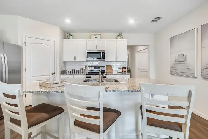 furnished kitchen with island in home
