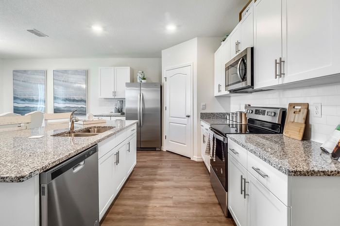 furnished kitchen with island in home
