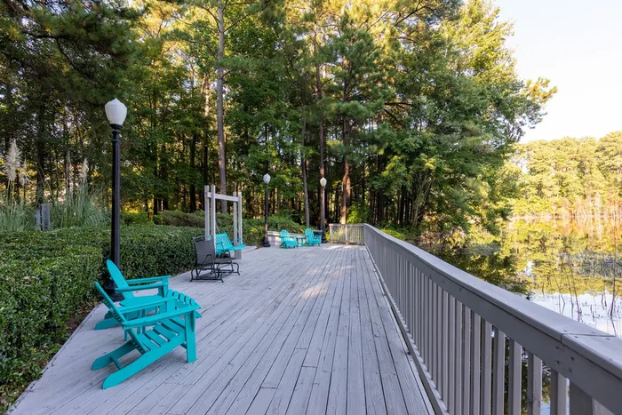Deck are with chairs looking over the water