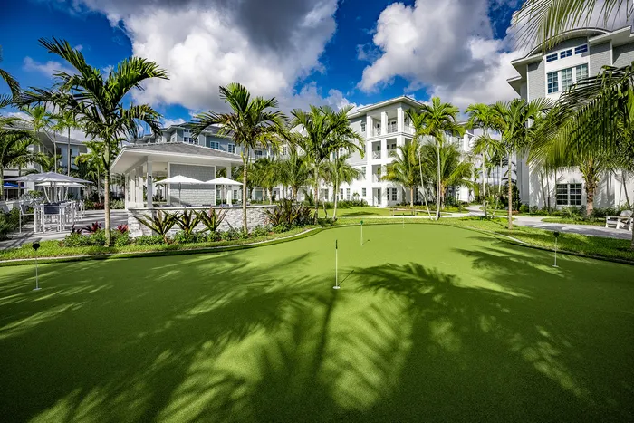 outdoor golf course outside apartment building in daytime