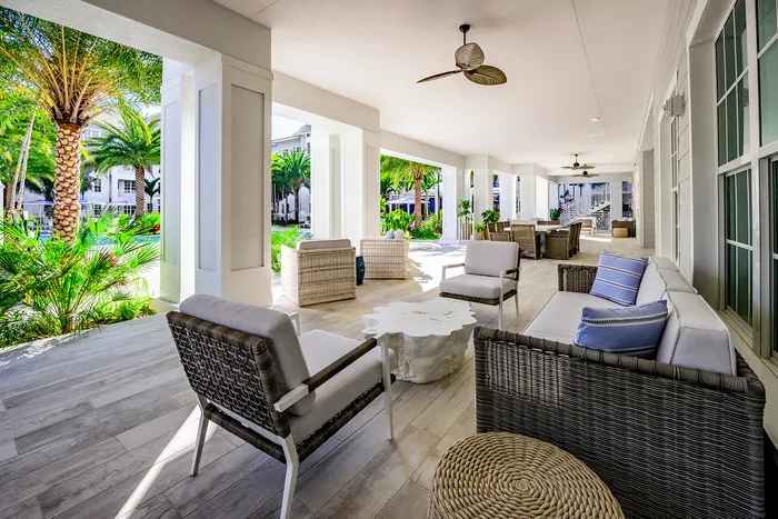 outdoor patio area next to pool in daytime