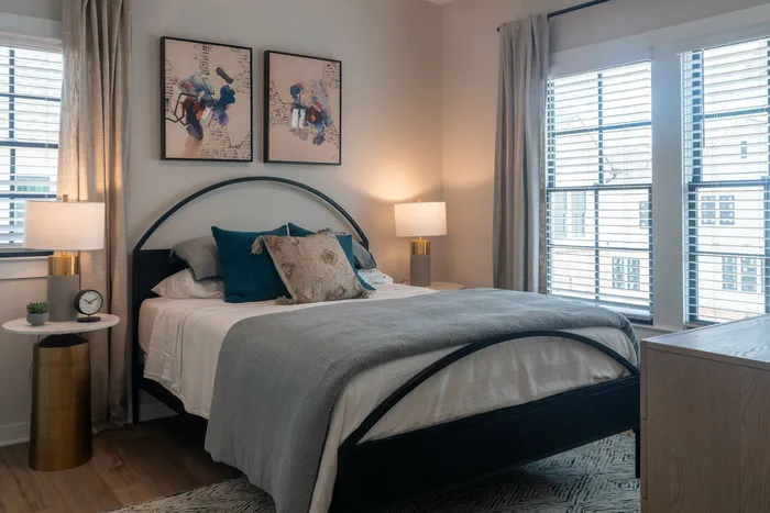 Furnished primary bedroom with bed and side tables