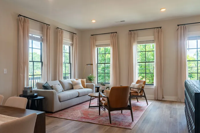 Furnished living room with couch and chairs