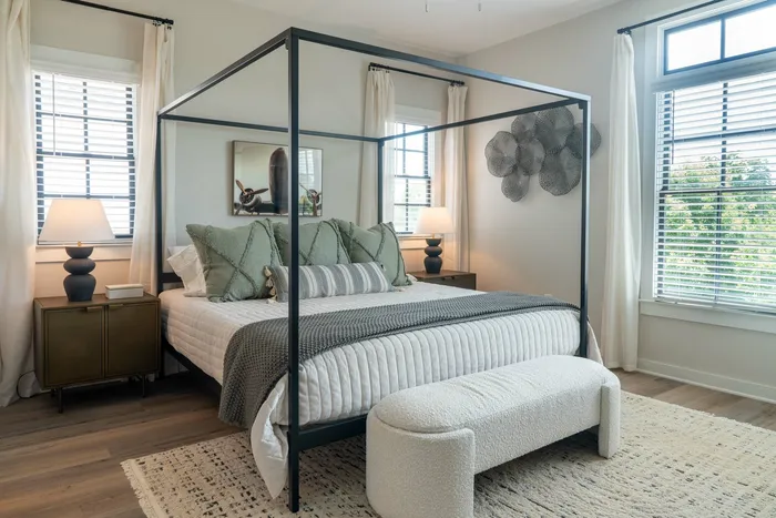 Furnished primary bedroom with bed and side tables