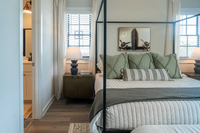 Furnished primary bedroom with bed and side tables