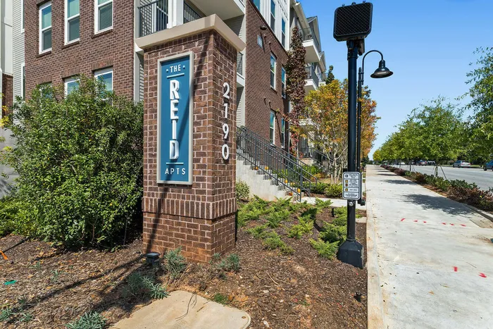 exterior pool and apartment building on sunny day