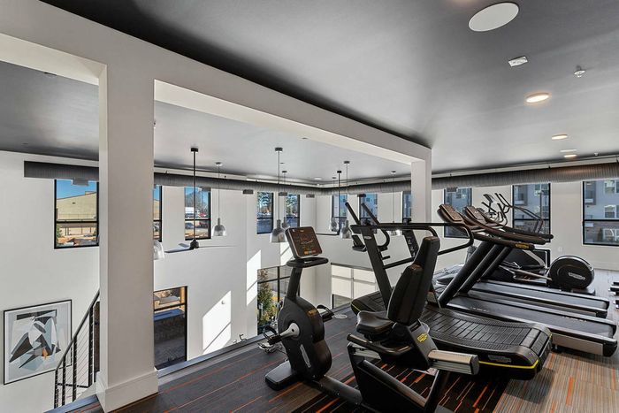 furnished fitness center balcony with equipment