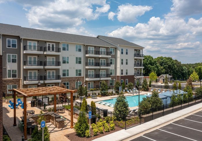 exterior pool and apartment building on sunny day