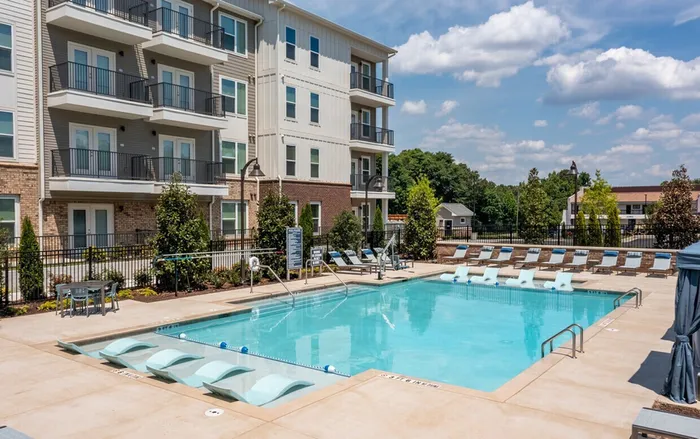 exterior pool and apartment building on sunny day
