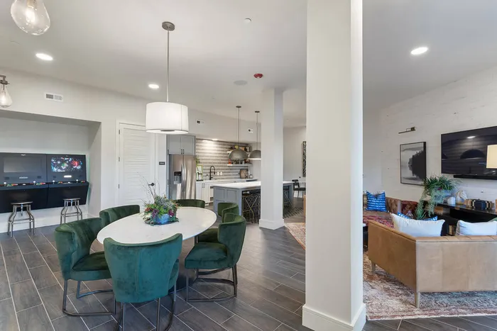 furnished clubhouse area with seating and privacy rooms