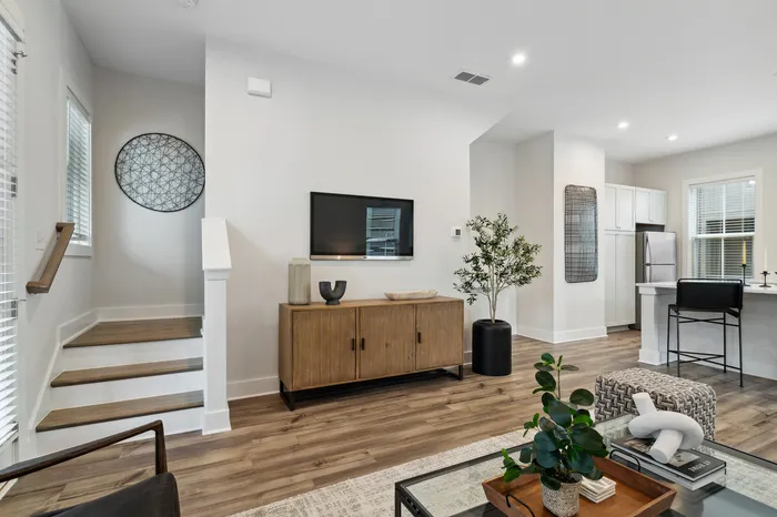 furnished living area with staircases in home