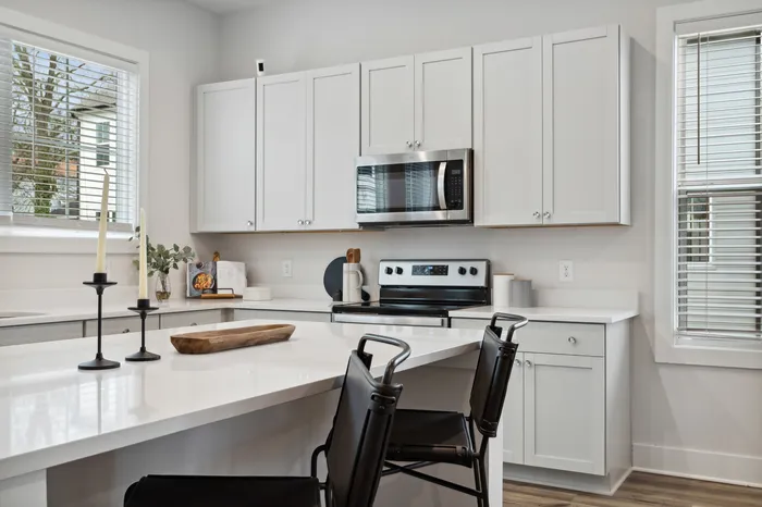 furnished kitchen with island in home