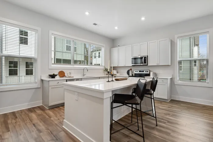 furnished kitchen with island in home