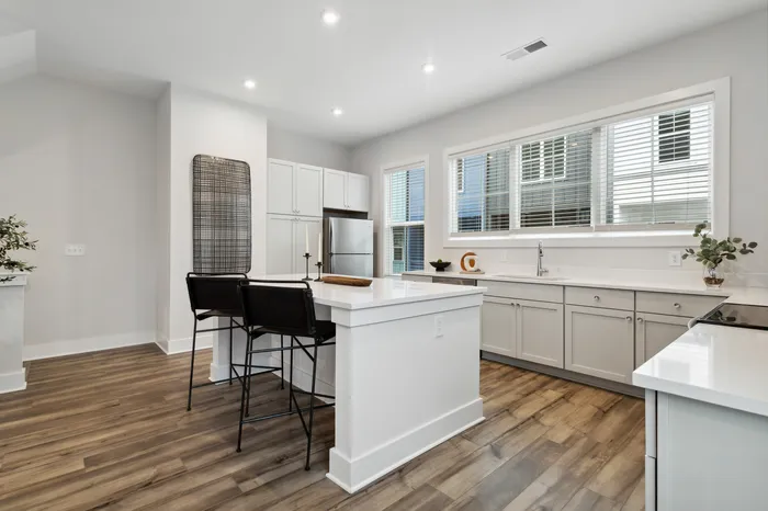 furnished kitchen with island in home