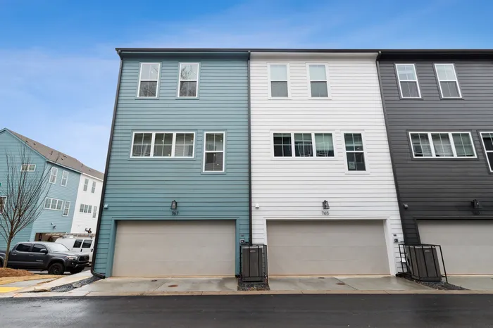 row of townhomes with garages in daytime