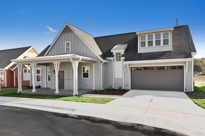 Exterior of home with garage on a sunny day